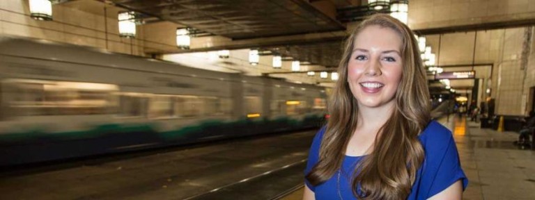 Student standing in train station