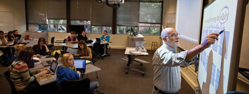 Professor writing on smart board