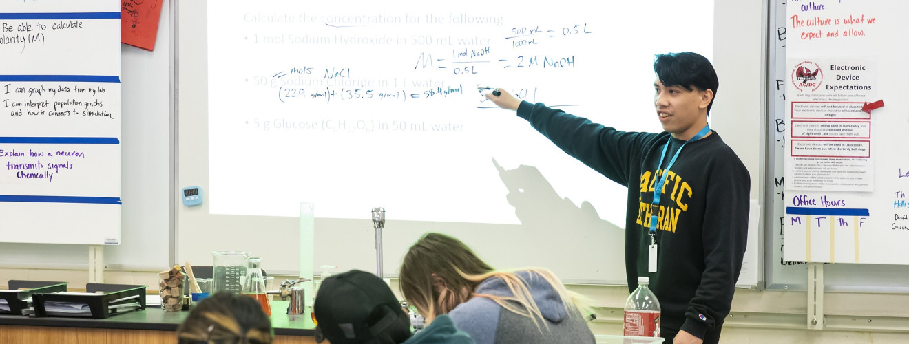 Recent MAE grad Nic Celebrado leads a chemistry class.