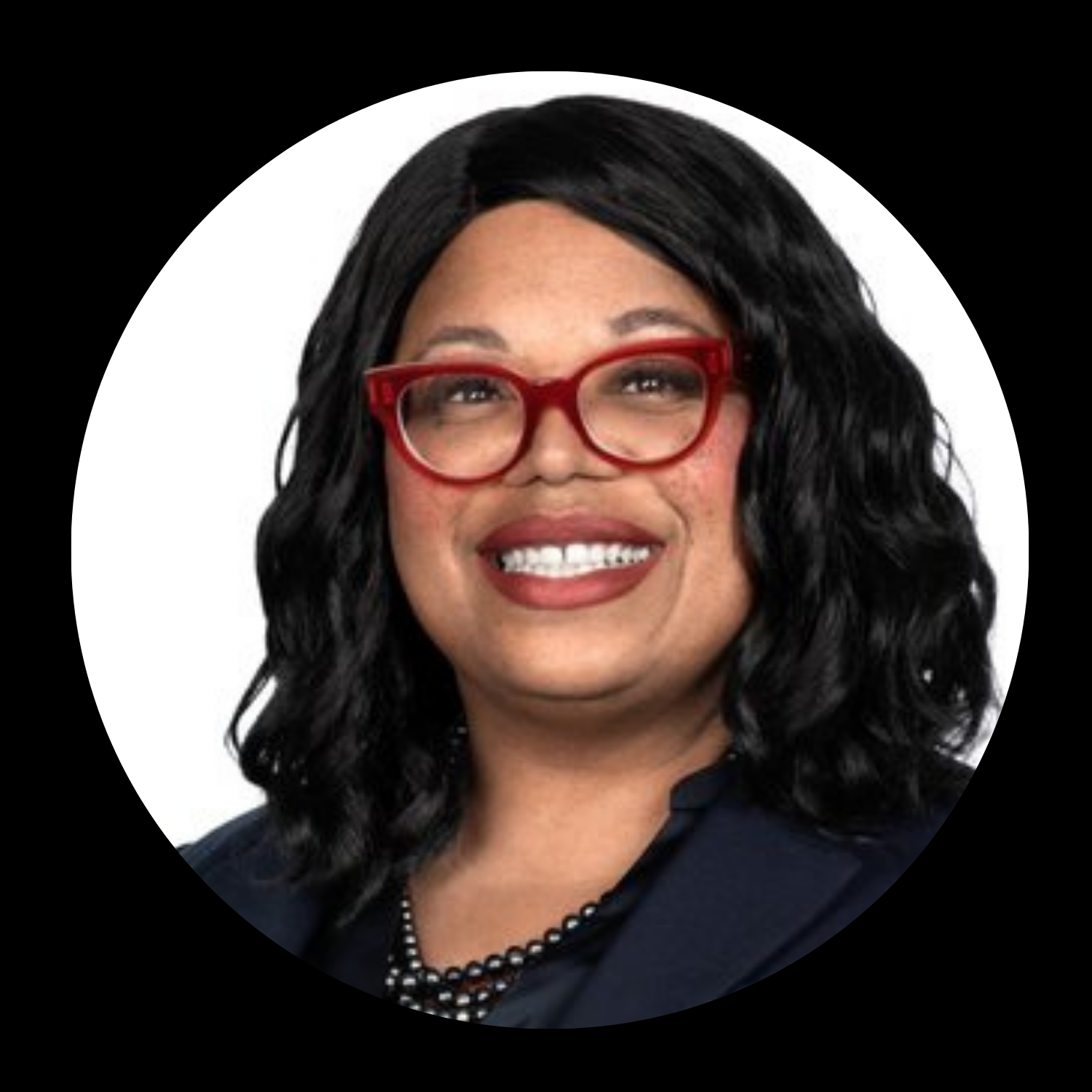 Photo of Shirline Wilson, smiling and wearing glasses.