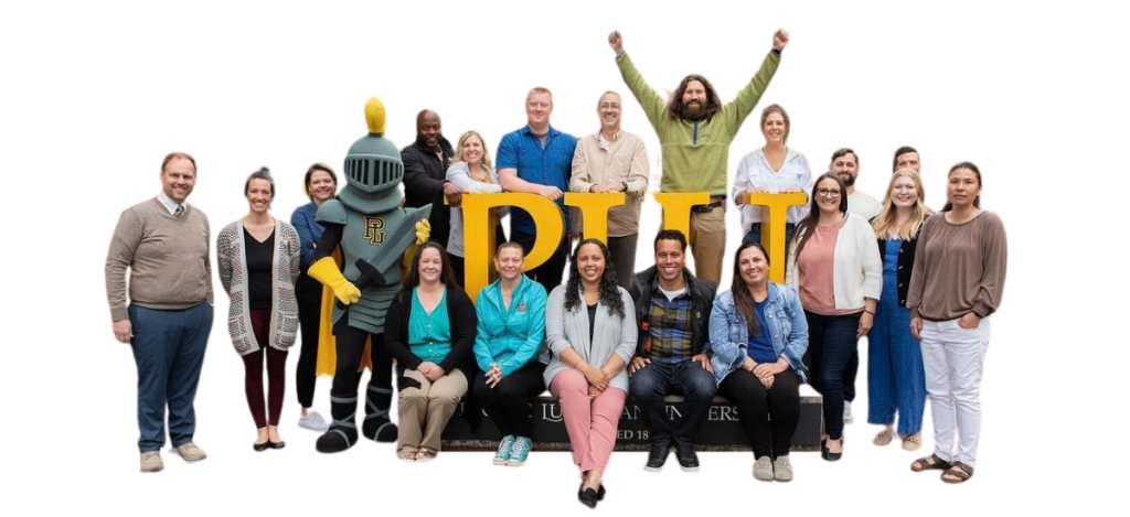 principal prep header group of principal candidates in 2024, sitting and standing around the PLU sign on campus, also with Lance-a-Lute who is a knight mascot