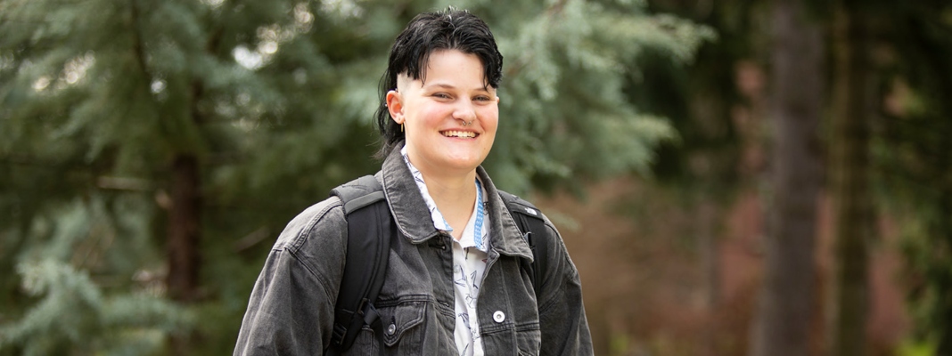 Allison Sheflo on campus by trees.