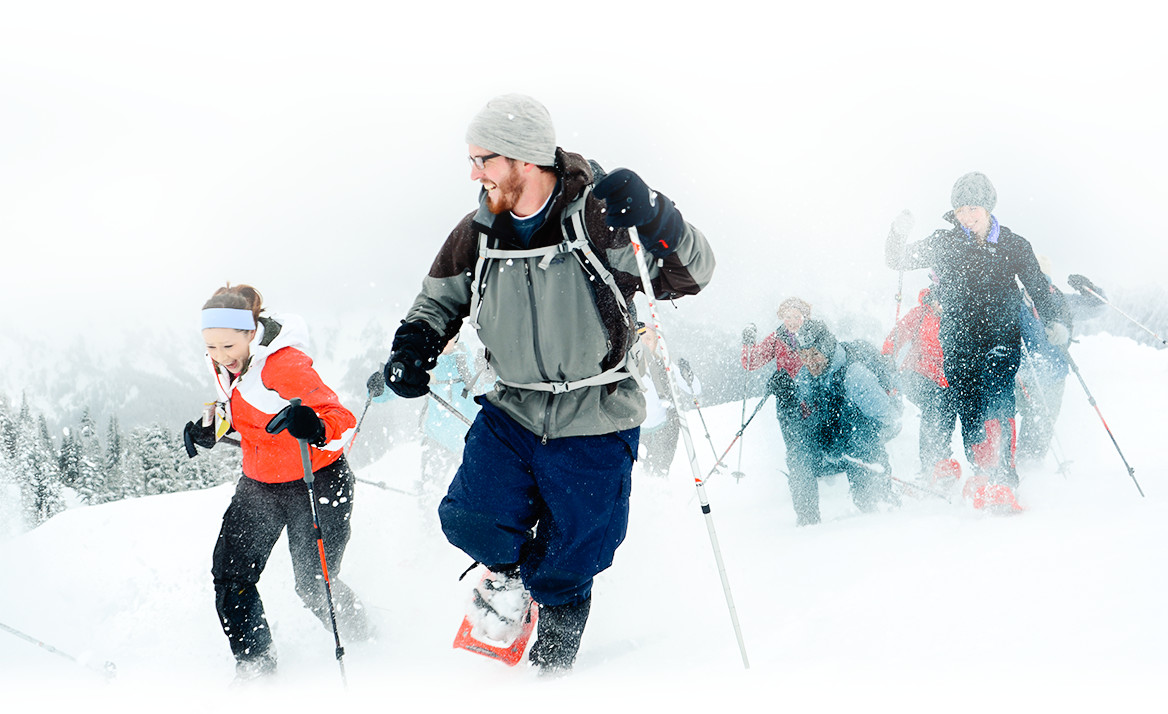 explore2016-bannerhero-exploresnow students snowshoeing on a mountain