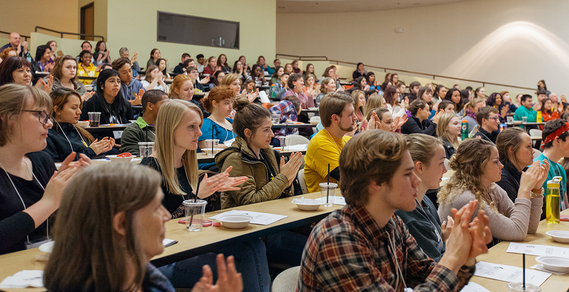 students sitting in an auditorium