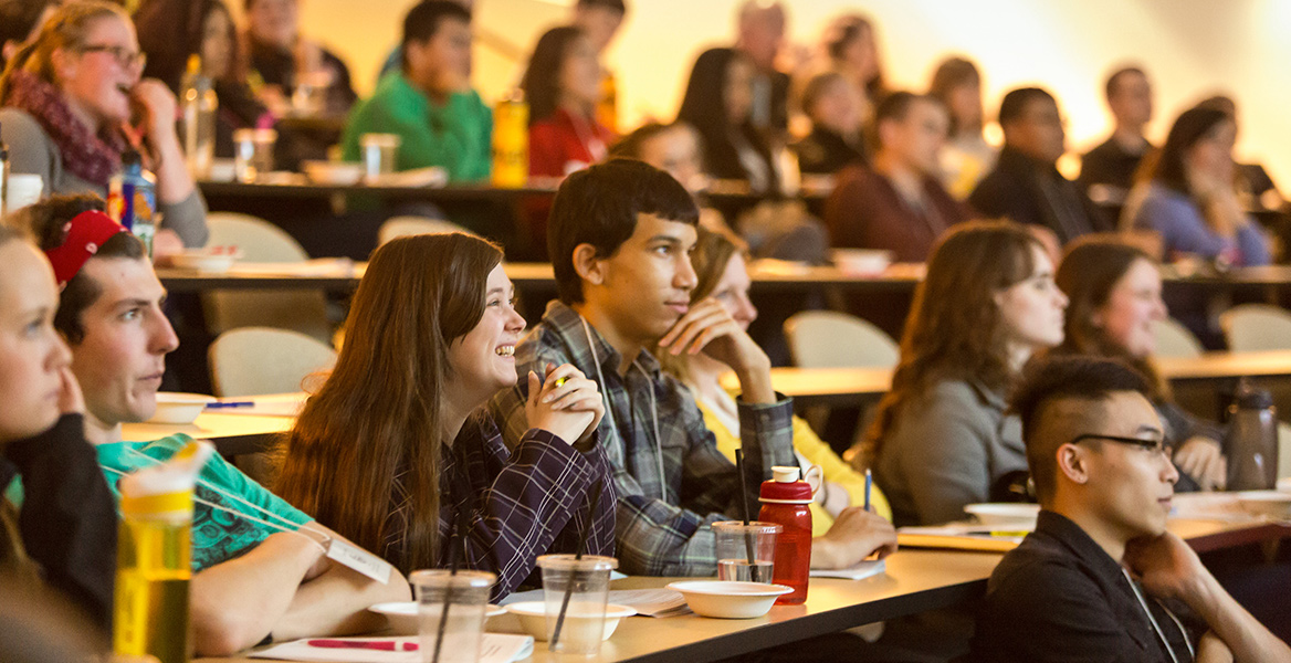 students sitting in auditorium