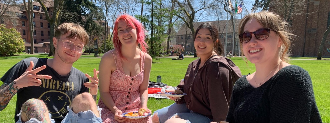 Students enjoying picnic on a sunny day.