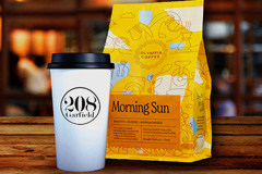 Coffee-front-page Olympia morning sun coffee bag and a 208 Garfield paper to go cup