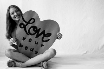 love your body student holding sign