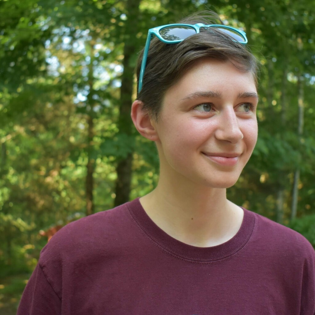 Photo of Isaac Madsen-Bibeau with trees in the background