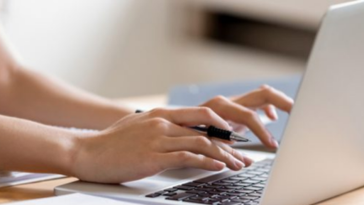 Person typing on a laptop