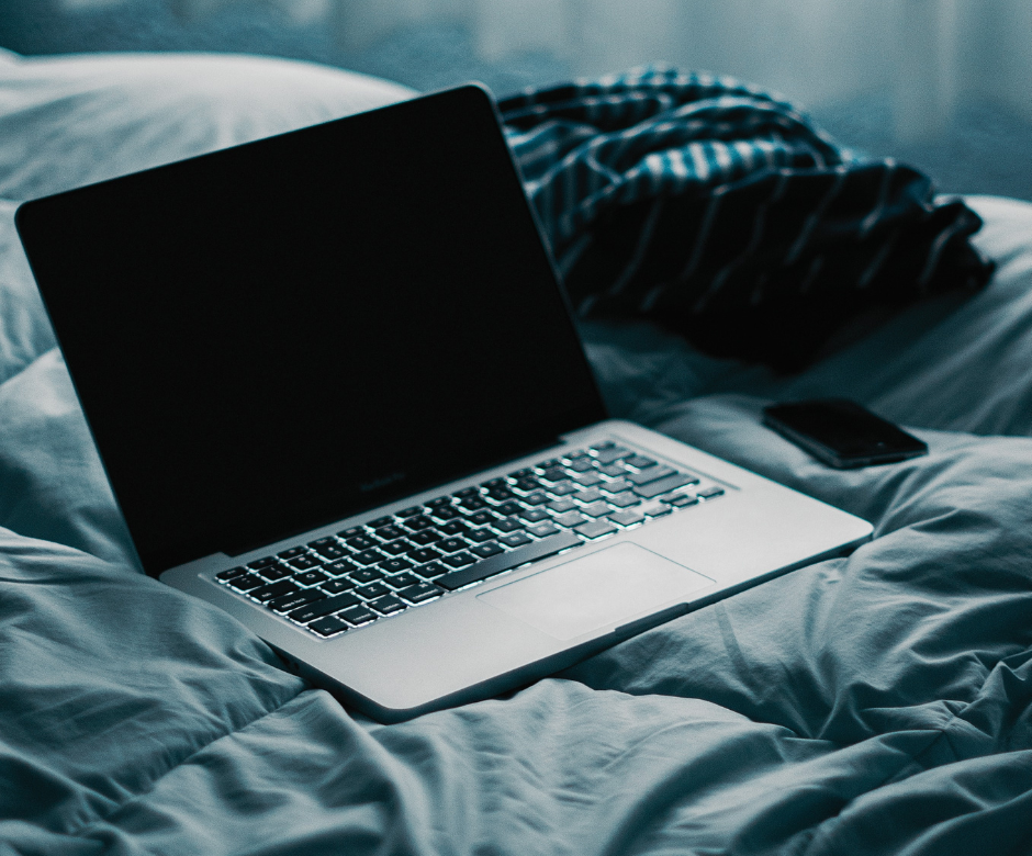 A computer on a bed