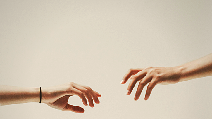 Hands reaching out to one another