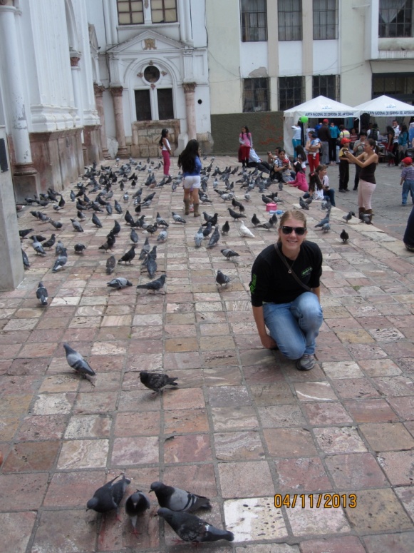 brittany peterson on street with pigeons