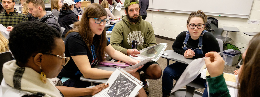 Students study reproductions of artifacts from the Holocaust Center for Humanity brought by Ilana Conne Kennedy to a history class taught by Prof. Lisa Marcus at PLU, Wednesday, Nov. 8, 2017. (Photo: John Froschauer/PLU)