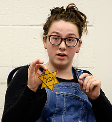 Students study reproductions of artifacts from the Holocaust Center for Humanity