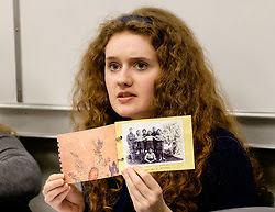 Students study reproductions of artifacts from the Holocaust Center for Humanity