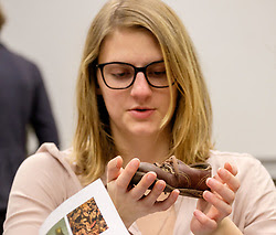 Students study reproductions of artifacts from the Holocaust Center for Humanity