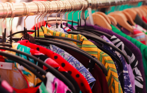 Homecoming spirit week: Throwback Day An image of a rack of bright colored clothing