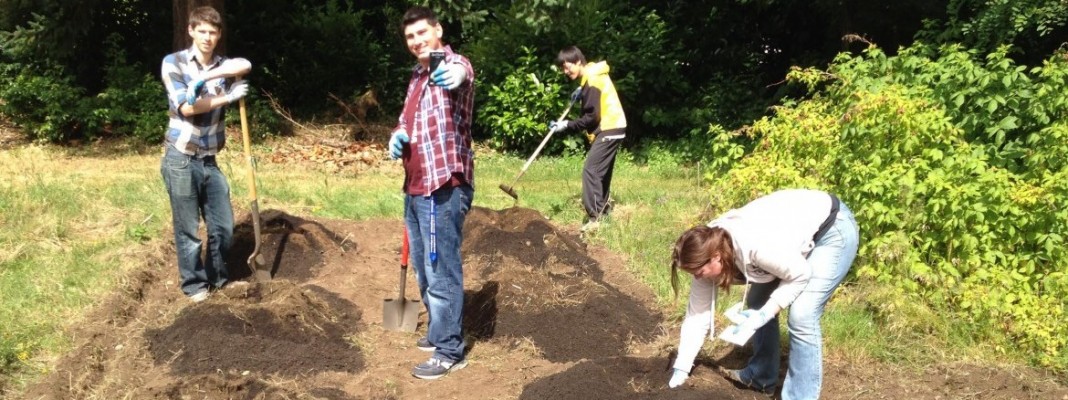 Christian ethics students working in Trinity Lutheran garden
