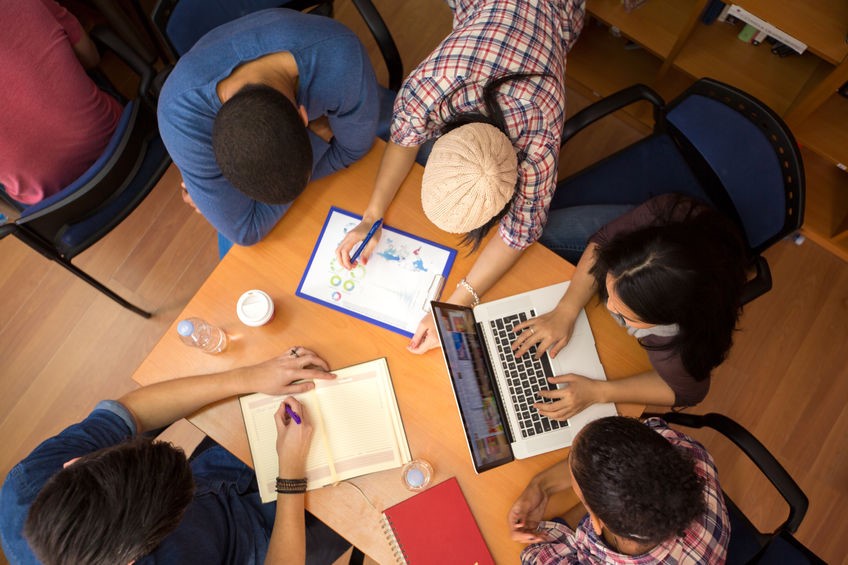 Students studying around the comptuer
