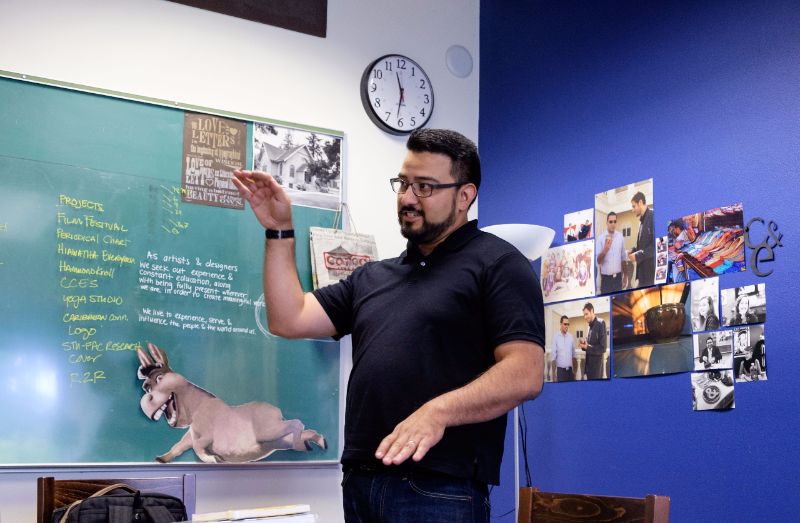 J.P. Avila standing at the chalkboard