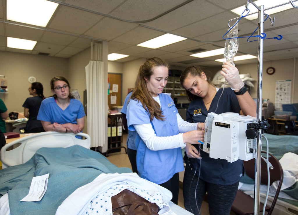 Nursing students in the Ramstad lab learning how to do blood transfusions and inserting intravenous lines at PLU, Tuesday, May 1, 2018. (Photo: John Froschauer/PLU)