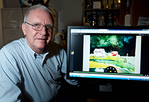 Craig Cornwall reviewing watercolor paintings for his PLUTO online class at PLU on Monday, March 9, 2015. (Photo/John Froschauer)