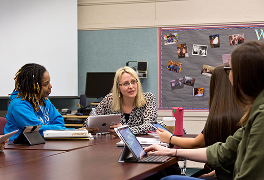 Elisabeth Esmiol Wilson working with iPads in a Marriage and Therapy class on Wednesday, April 15, 2015. (Photo: John Froschauer/PLU)