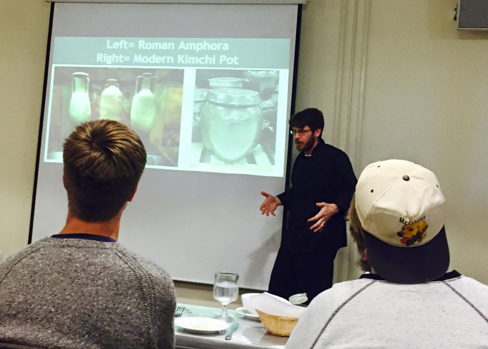Doug Hinners presents Roman food and dining in the Anderson University Center at PLU on Tuesday, April 21, 2015. The project is a capstone for Hinners where he researched ancient food and how it is prepared. (Photo: John Froschauer/PLU)