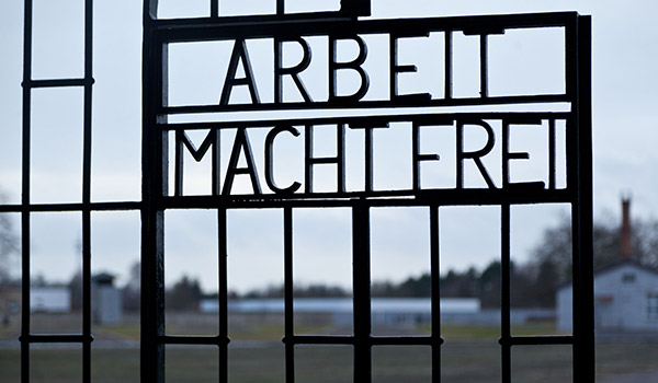 A fence with the words "Arbeit Macht Frei" in Auschwitz, Germany