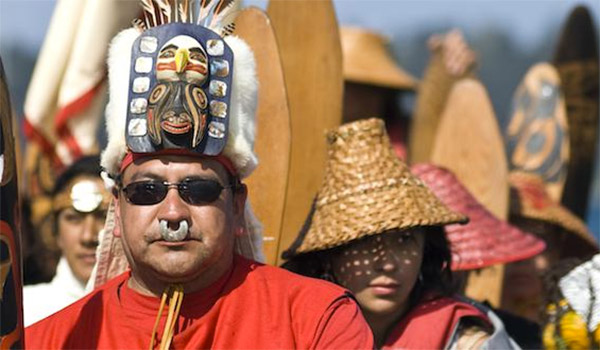 Indigenous people wearing different head gear
