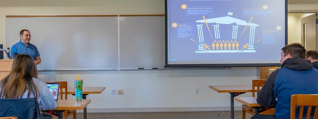 Michael Artime lecturing in a political science class at PLU (PLU photo/Silong Chhun)