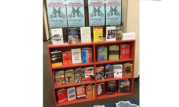 On Exhibit: books related to Disarming Polarization symposium 2020