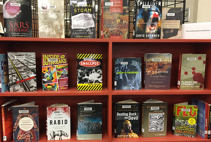 photo of books from the collection on exhibit in the display "Pandemics: History & Responses"