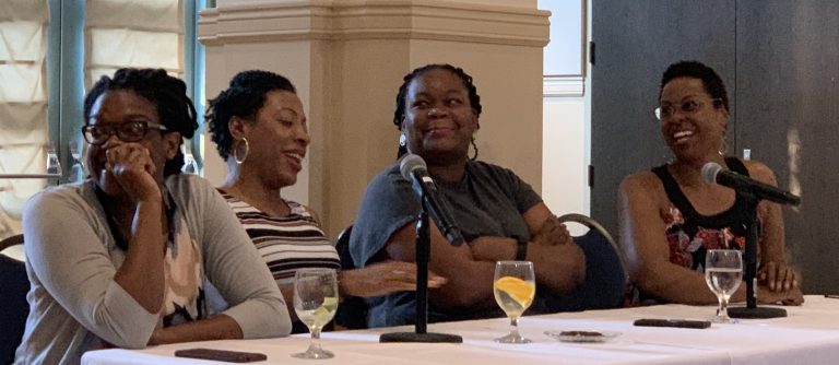 board members of Mathematically Gifted and Black, sitting together at a long table.