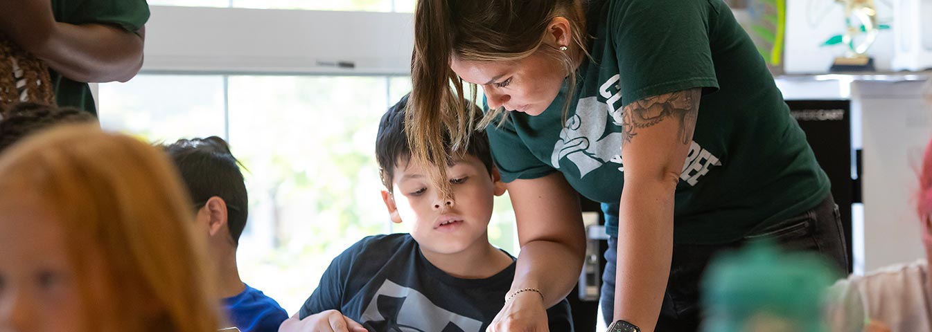 Brianna Wells with the help of Eva Dumeni lead reading lessons, Friday, Sept. 15, 2023, at Clover Creek Elementary School.