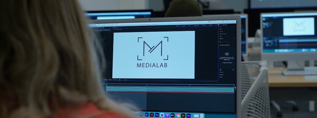 Student using Adobe After Effects to animate the MediaLab logo.