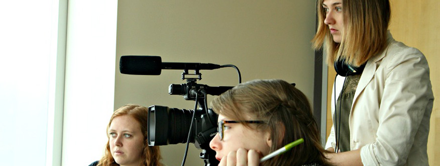 3 students working with video camera