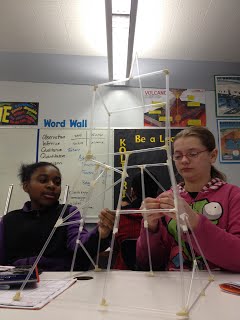Students working with straws