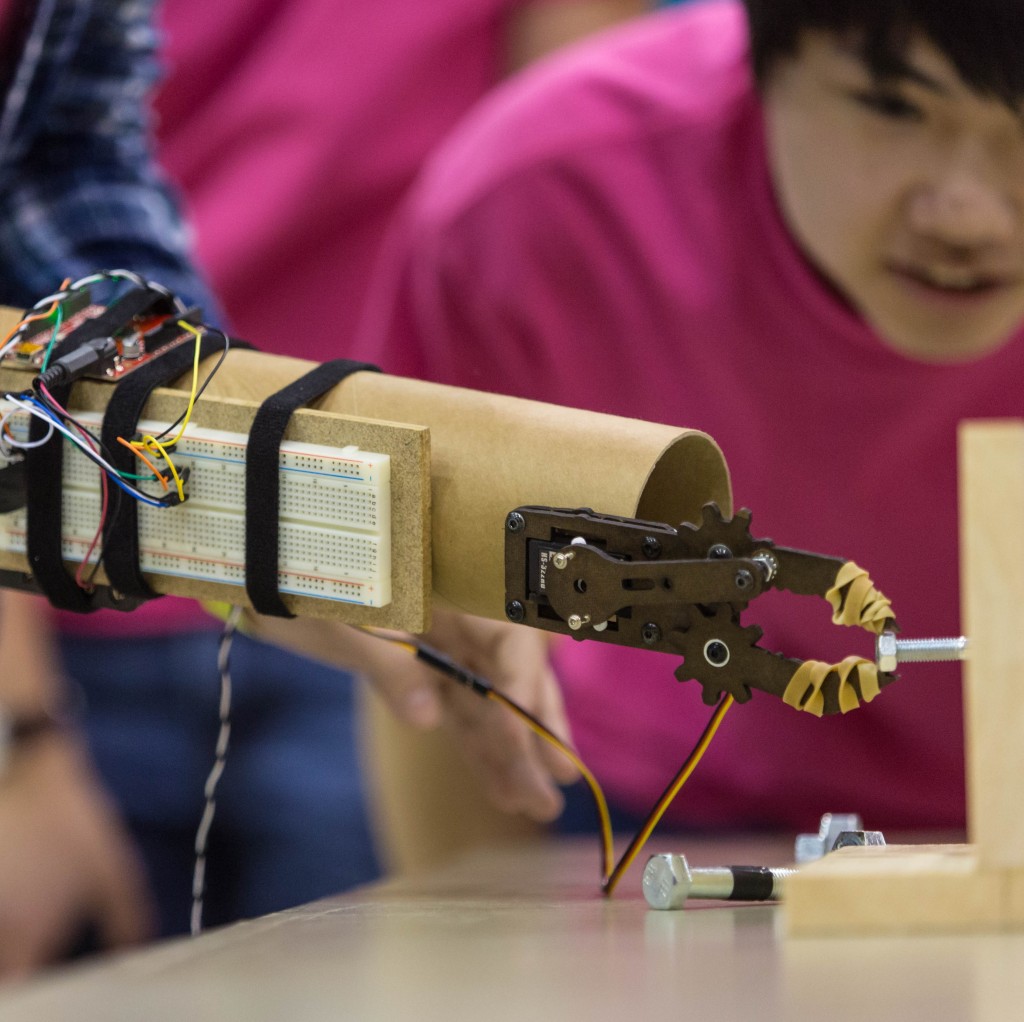 Student looking at an experiment, MESA day for area elementary to high school students at PLU, on Tuesday, March 29, 2016. (Photo: John Froschauer/PLU)