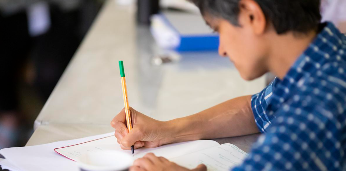 MFA student completing a writing exercise during the summer residency.