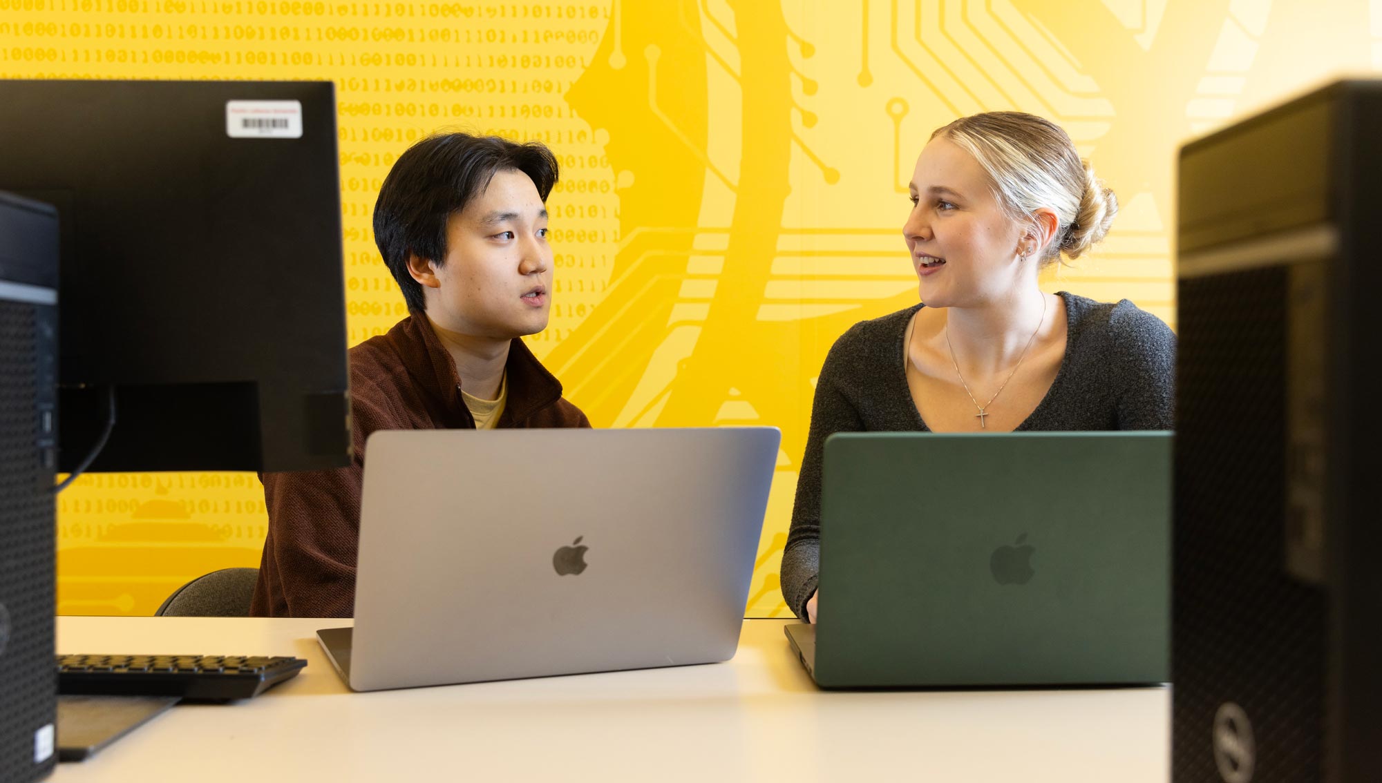 Andrew Lee and Stacie Spahr developed an app for the White Pass Ski Patrol to help them with their scheduling, Friday, Feb. 14, 2025, at PLU. (PLU Photo / Sy Bean)