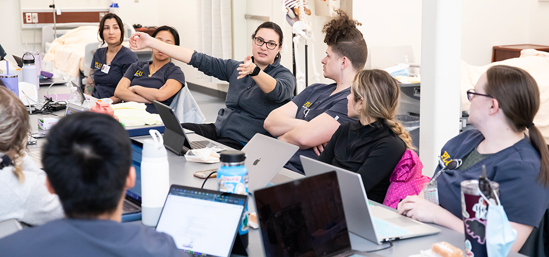 Students in NURS 403 practice placing central lines with Clinical Instructor of Nursing Kristina Kenning.
