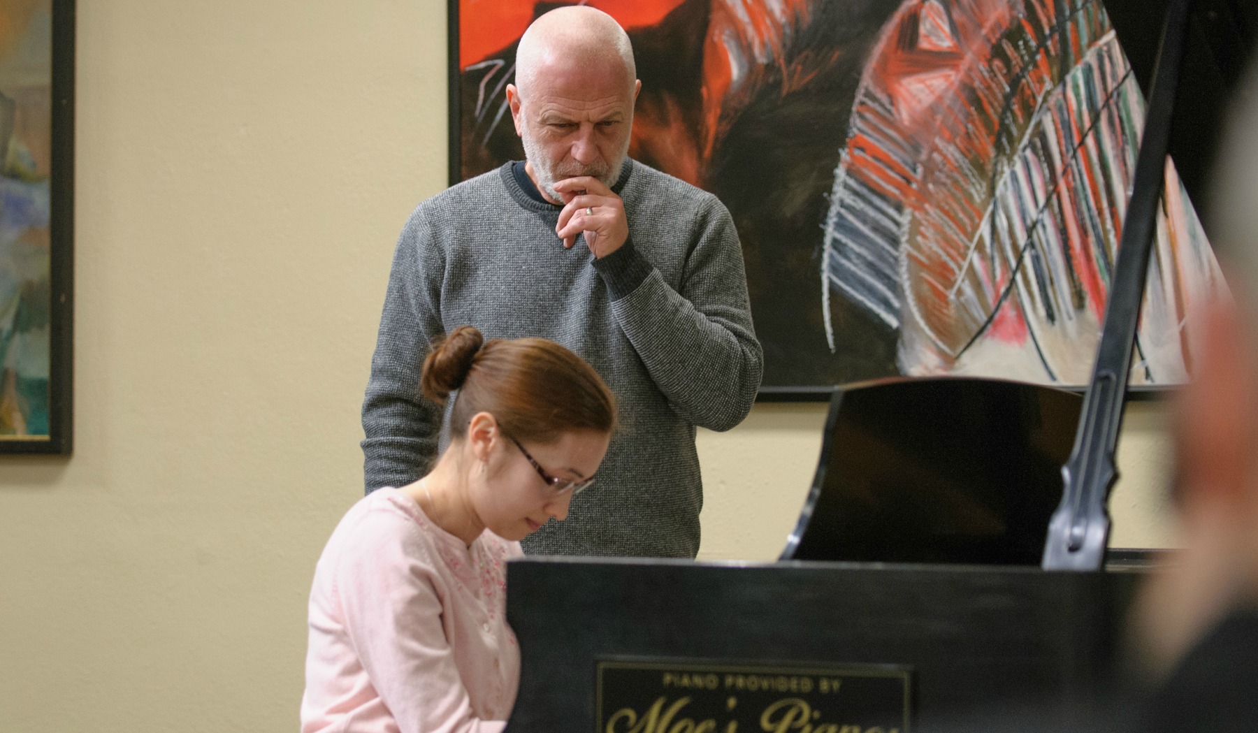 Natalie Burton '13 plays a Bach piece on the piano for master pianist Vladimir Feltsman during Portland Piano International's Up Close With the Masters series. (Photo courtesy of Portland Piano International)