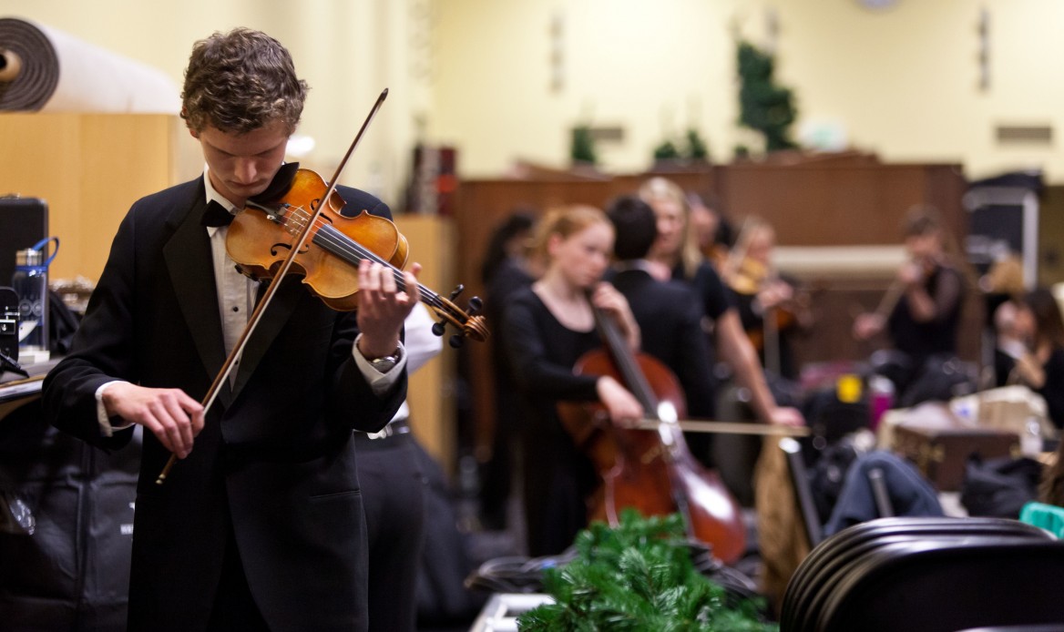 Student violinist practicing at the PLU Christmas 2015, 