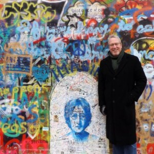 Ed Powell in front of John Lennon's wall in Prague.