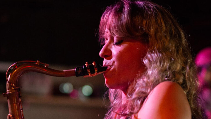 Kate Olson playing saxophone. Photo by Danette Davis.