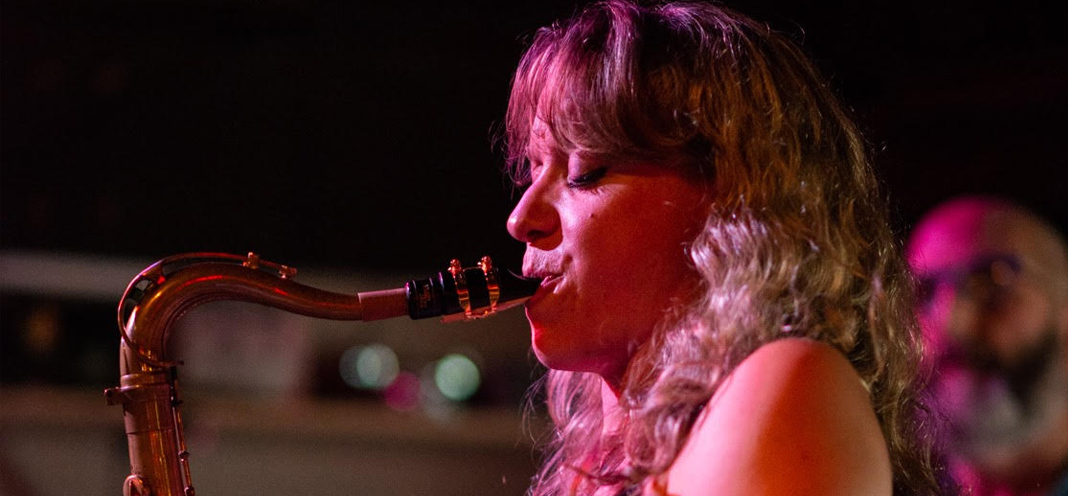 Kate Olson playing saxophone. Photo by Danette Davis.