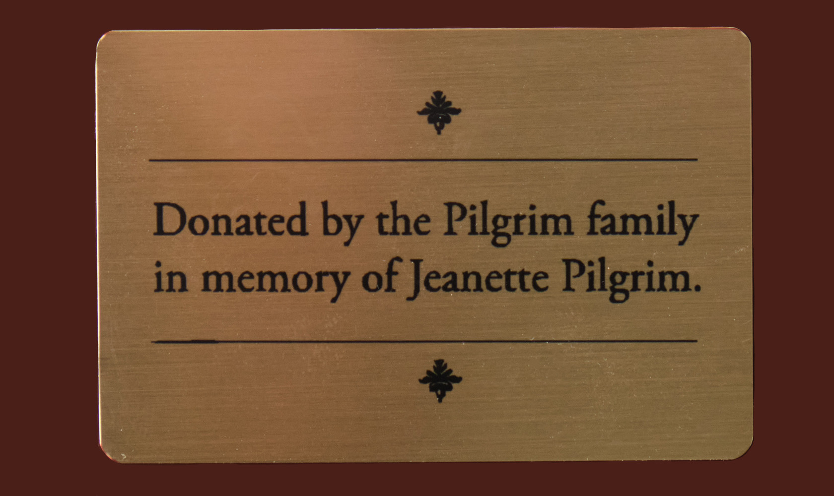 Memorial plaque affixed to the harpsichord commemorating the donation.