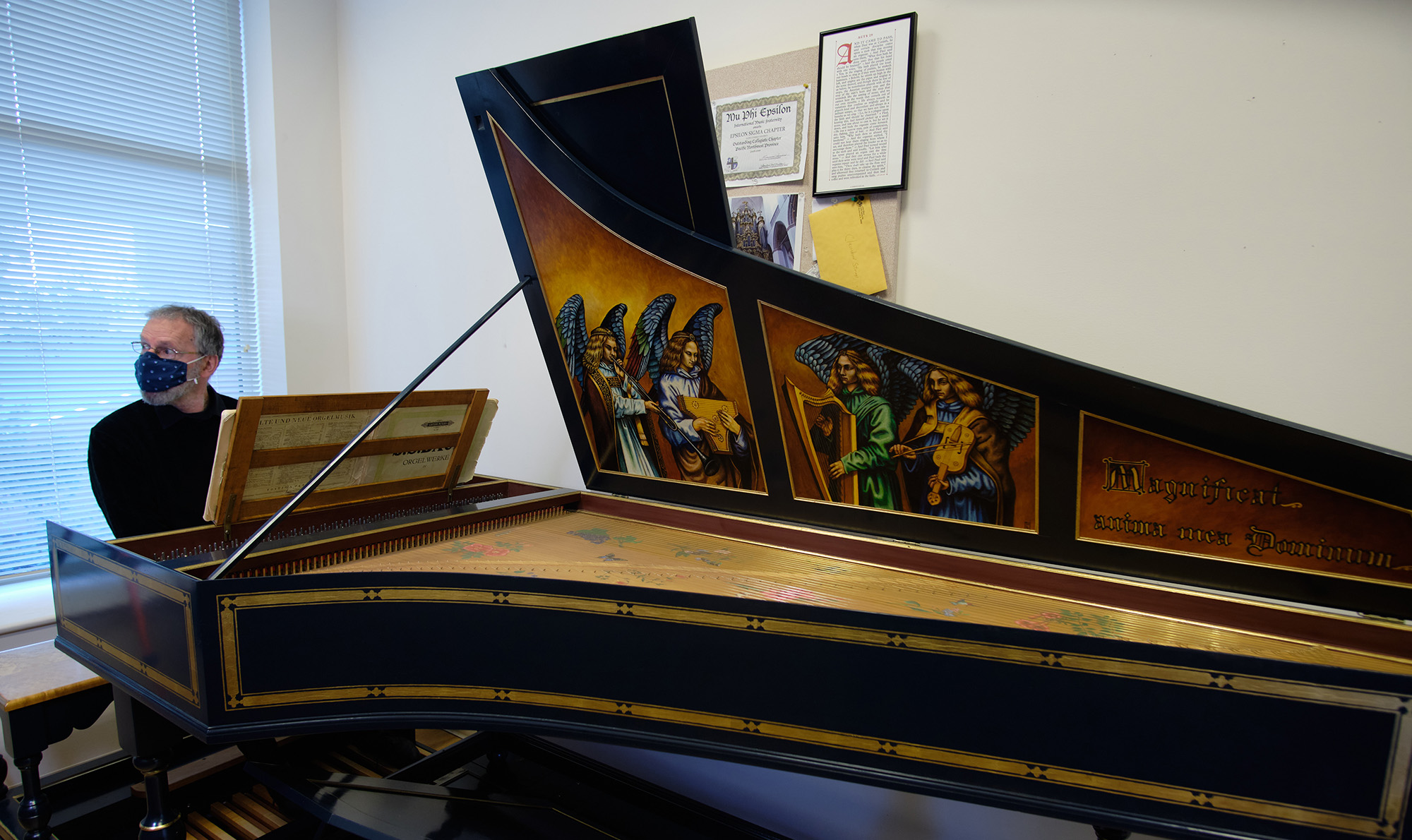 Paul Tegels, organist and Associate Professor of Music Paul Tegels plays the harpsichord donated by the Pilgrim family in his office, Tuesday, Feb. 9, 2021, at PLU. (PLU Photo/John Froschauer)